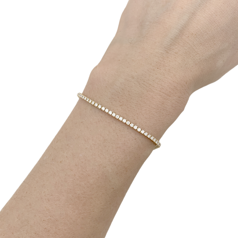 Tennis bracelet gold, diamonds.