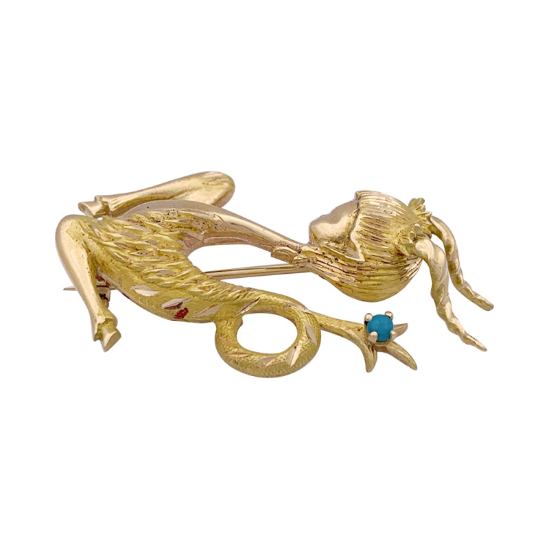 Vintage gold, turquoise "Capricorn" brooch.