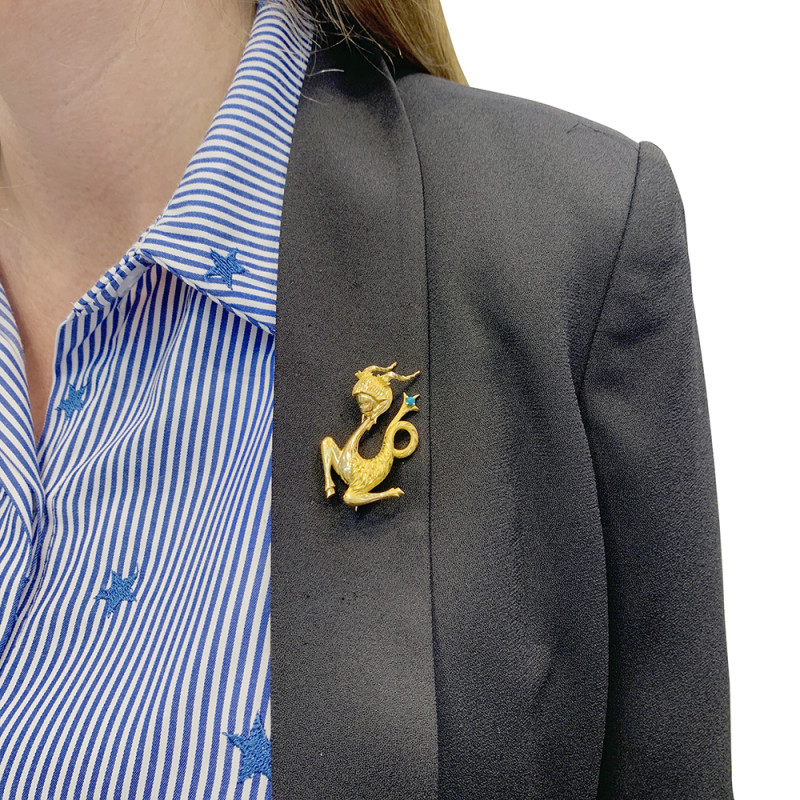 Vintage gold, turquoise "Capricorn" brooch.