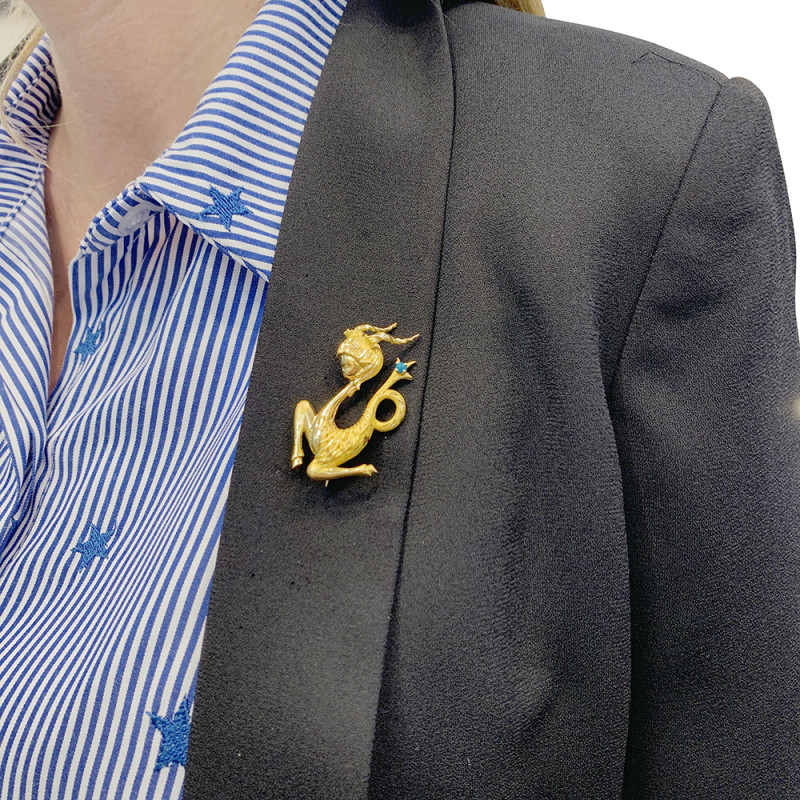 Vintage gold, turquoise "Capricorn" brooch.