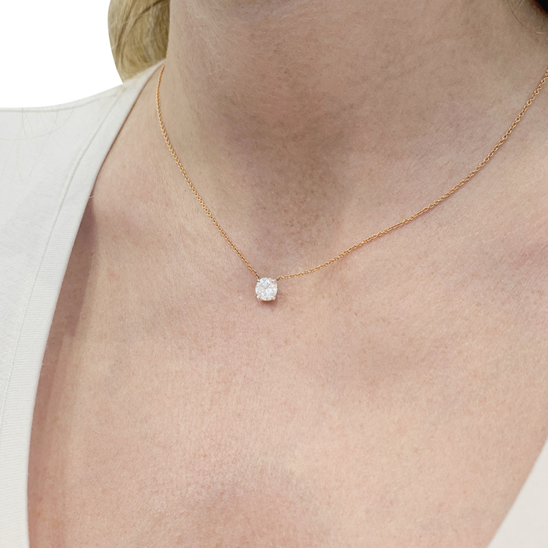Gold and diamond solitaire necklace.