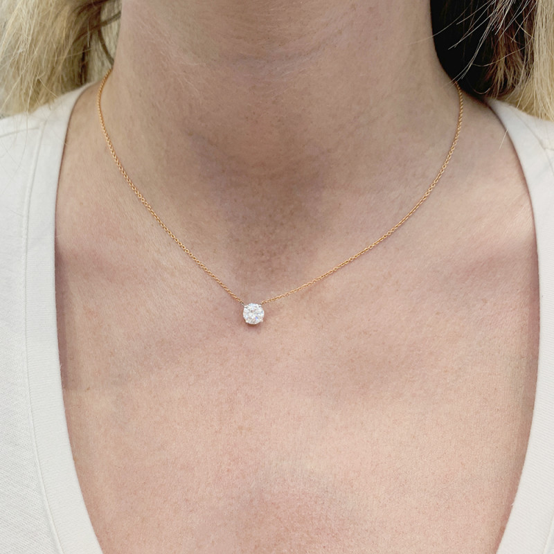 Gold and diamond solitaire necklace.