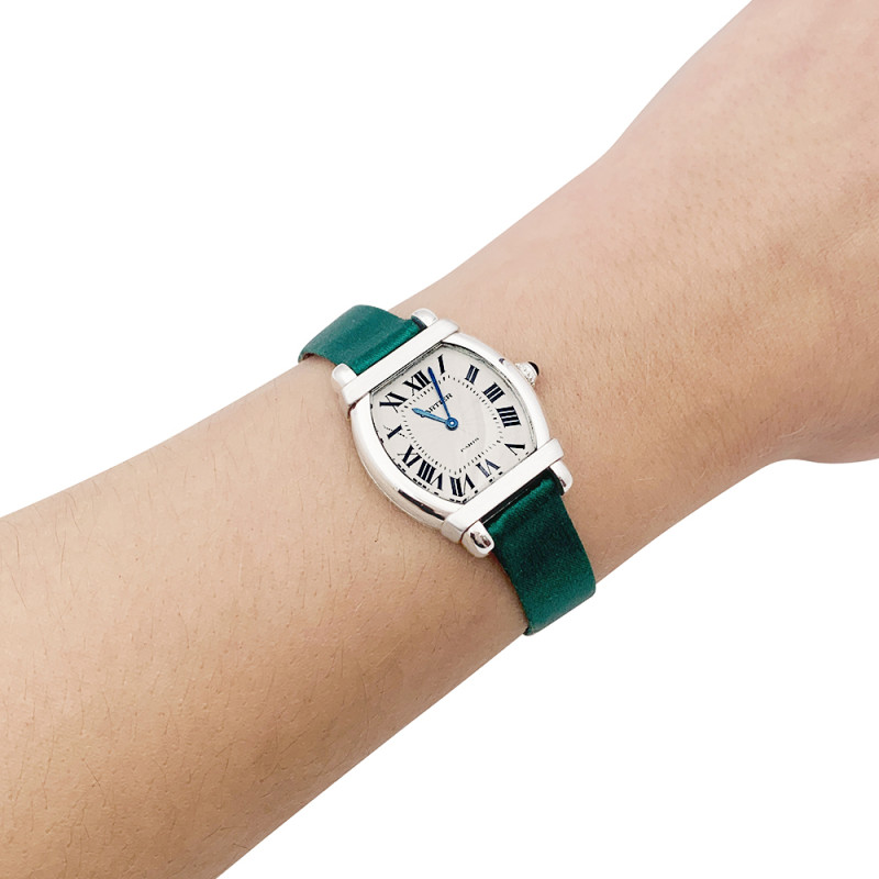 Montre Cartier, "Tortue Chinoise", platine, or blanc, satin.