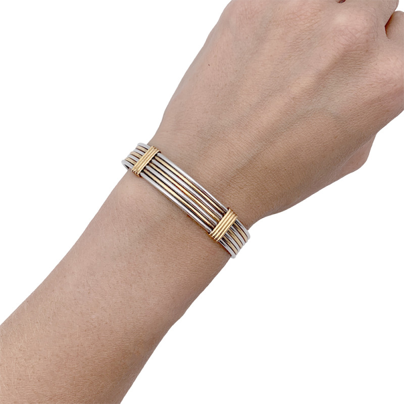 Bracelet Cartier or jaune et acier.