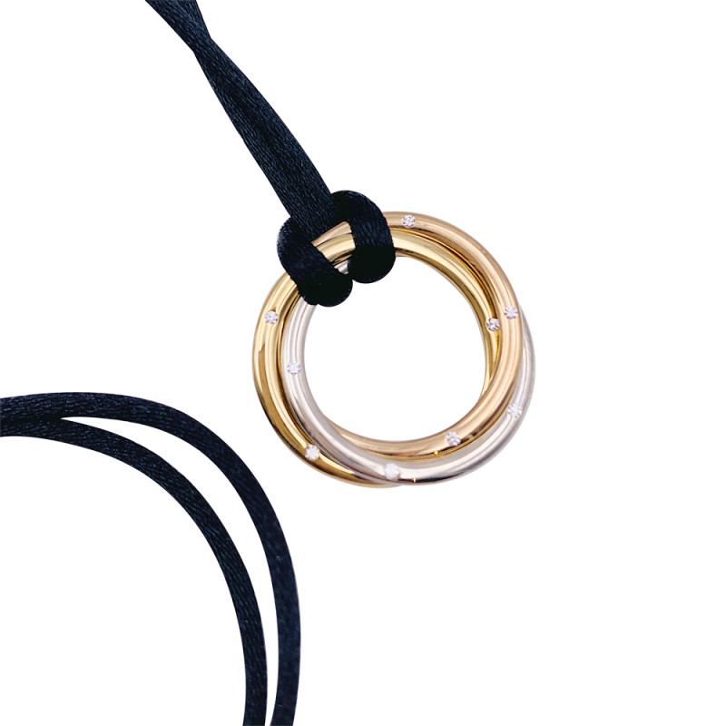 Collier Cartier, "Trinity", trois ors, diamants.