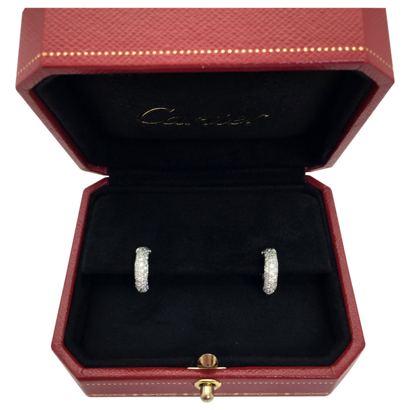 Boucles d'oreilles Cartier, modèle " Etincelle", diamants et platine.