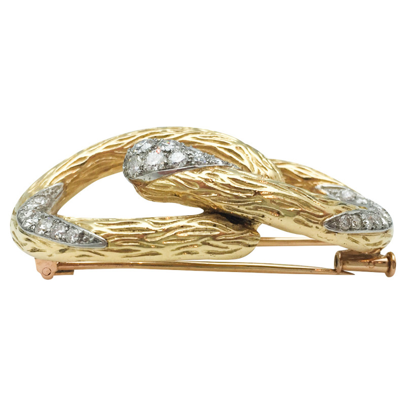 Broche Mauboussin "Boucle" en or jaune et platine, diamants.