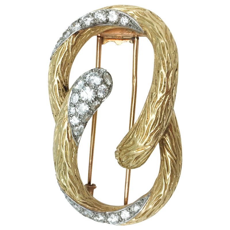 Broche Mauboussin "Boucle" en or jaune et platine, diamants.