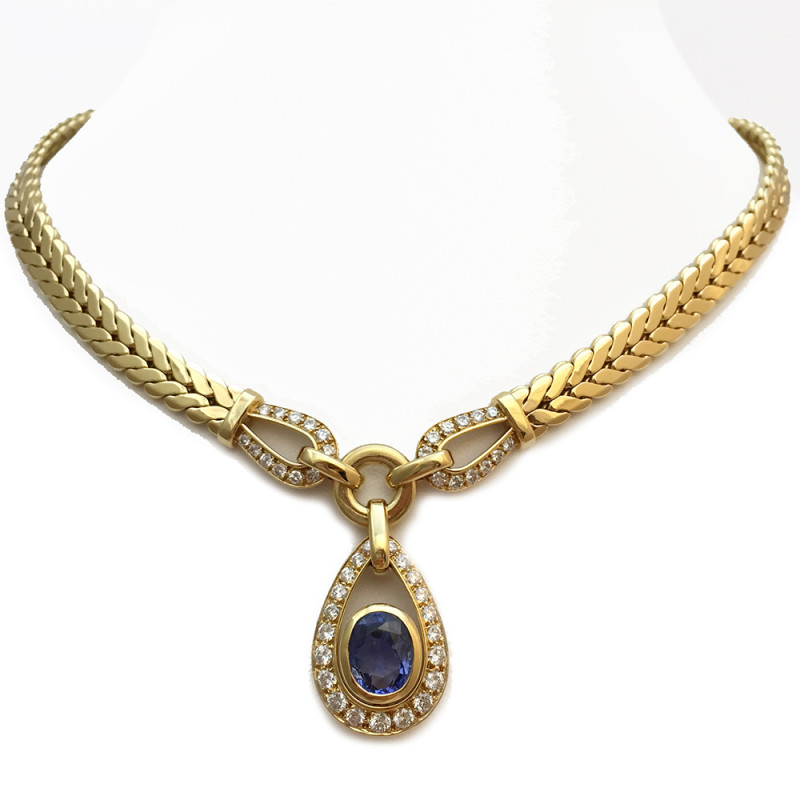 Collier Cartier, or jaune, saphir et brillants.