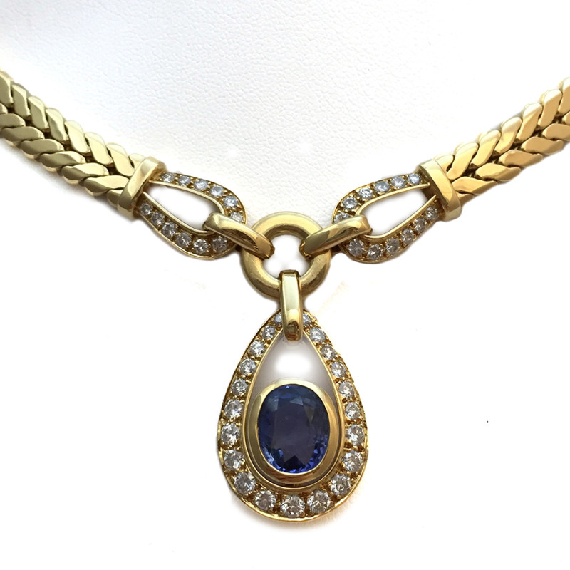 Collier Cartier, or jaune, saphir et brillants.