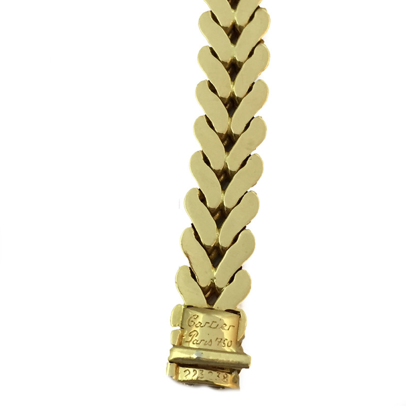 Collier Cartier, or jaune, saphir et brillants.